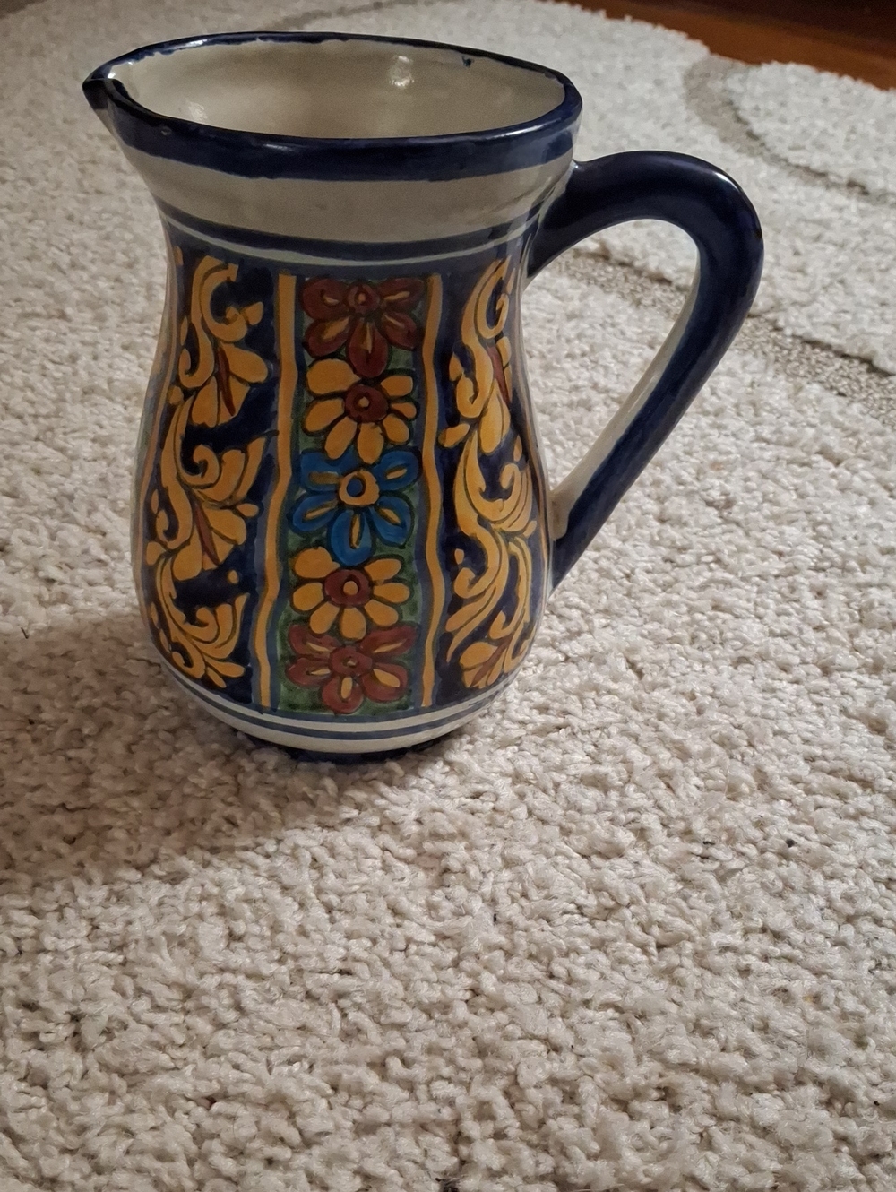 Hand-Painted Ceramic Pitcher in Blue and Yellow Floral Motif